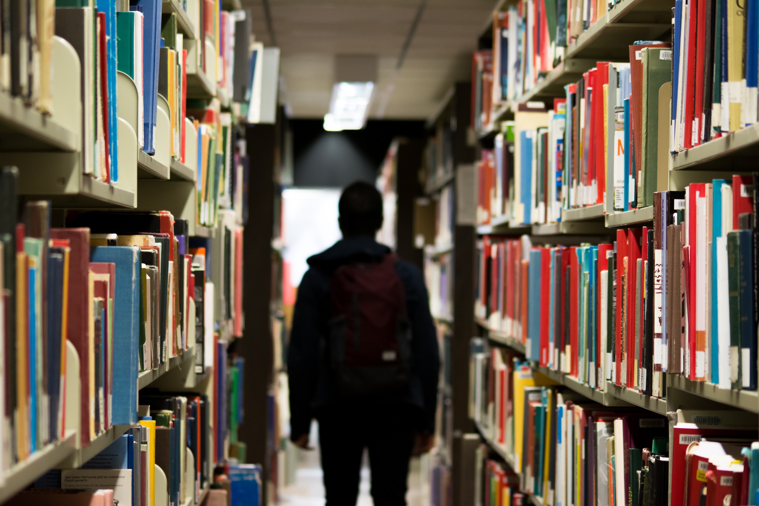 Student walking through library